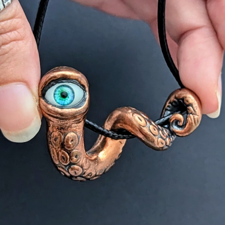 Tentacule alien oeil turquoise