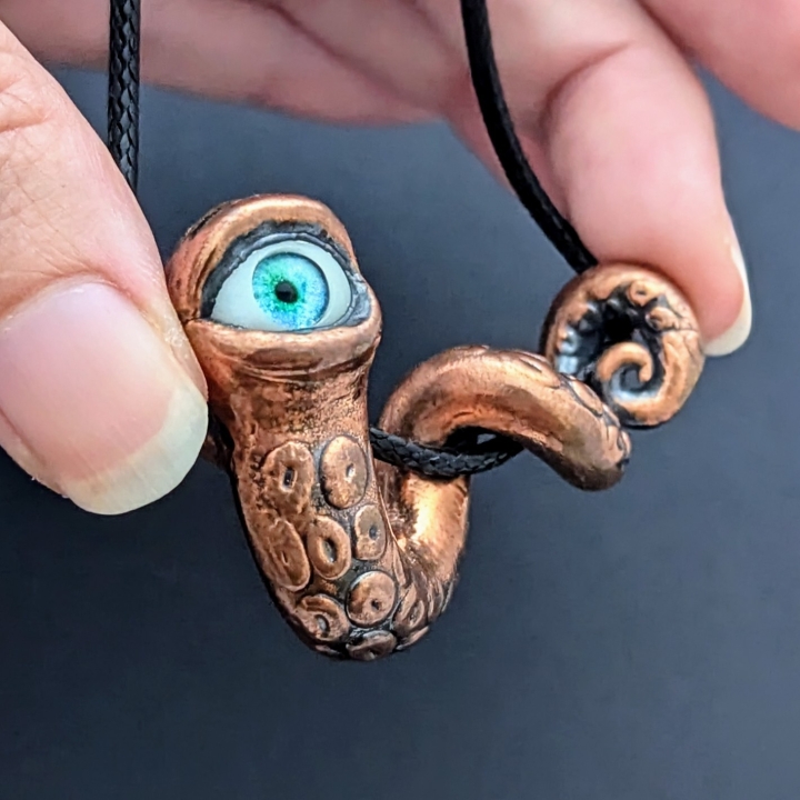 Tentacule alien oeil turquoise